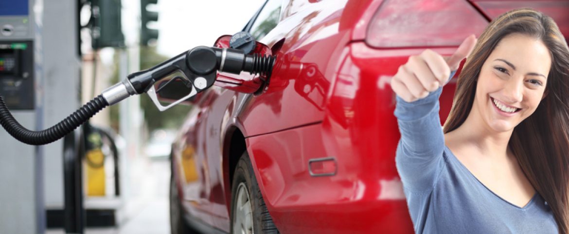 woman filling up car with gas