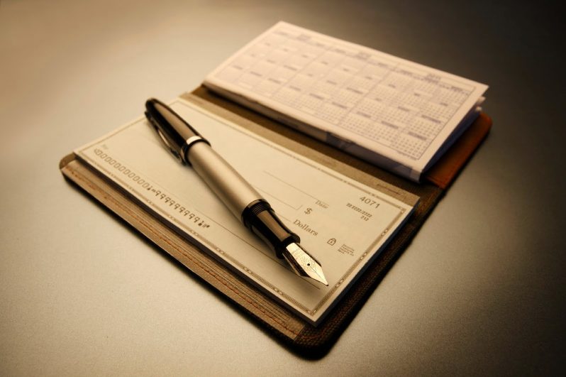 check book with pen